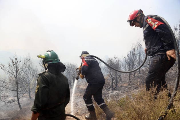 Forest Rangers Battle Wildfires In Bouira - Algeria Protection Civile firefighters intervene to extinguish wildfires in the mountains of Bouira, Algeria on July 21, 2026, as the blazes are reported under control according to the civil protection agency. Photo by Billel Bensalem APP ABACAPRESS.COM Bouira Algeria  Copyright: xBensalemxBillel APP ABACAx
