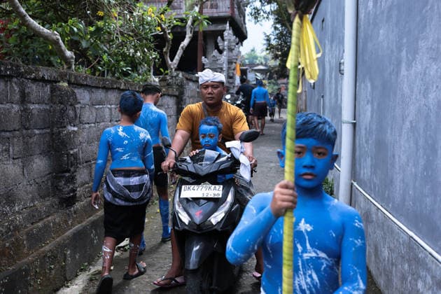 Ngerebeg ritual, a colorful tradition in Bali BALI, INDONESIA - JULY 22: Locals with painted bodies participate in the Ngerebeg ritual, a colorful traditional procession believed to expel evil spirits and bad luck from the village, on July 22, 2026 in Bali, Indonesia. Participants paint their bodies to resemble astral beings as they pray and march through the village. Johannes P. Christo Anadolu Bali Indonesia. Editorial use only. Please get in touch for any other usage.  Copyright: x2026xAnadoluxJohannesxP.xChristox