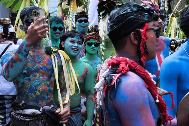 Ngerebeg ritual, a colorful tradition in Bali BALI, INDONESIA - JULY 22: Locals with painted bodies participate in the Ngerebeg ritual, a colorful traditional procession believed to expel evil spirits and bad luck from the village, on July 22, 2026 in Bali, Indonesia. Participants paint their bodies to resemble astral beings as they pray and march through the village. Johannes P. Christo Anadolu Bali Indonesia. Editorial use only. Please get in touch for any other usage.  Copyright: x2026xAnadoluxJohannesxP.xChristox