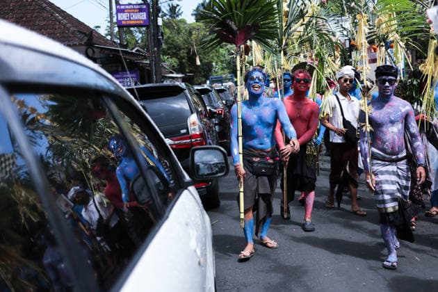 Ngerebeg ritual, a colorful tradition in Bali BALI, INDONESIA - JULY 22: Locals with painted bodies participate in the Ngerebeg ritual, a colorful traditional procession believed to expel evil spirits and bad luck from the village, on July 22, 2026 in Bali, Indonesia. Participants paint their bodies to resemble astral beings as they pray and march through the village. Johannes P. Christo Anadolu Bali Indonesia. Editorial use only. Please get in touch for any other usage.  Copyright: x2026xAnadoluxJohannesxP.xChristox