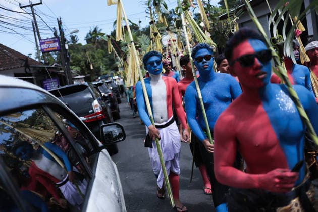 Ngerebeg ritual, a colorful tradition in Bali BALI, INDONESIA - JULY 22: Locals with painted bodies participate in the Ngerebeg ritual, a colorful traditional procession believed to expel evil spirits and bad luck from the village, on July 22, 2026 in Bali, Indonesia. Participants paint their bodies to resemble astral beings as they pray and march through the village. Johannes P. Christo Anadolu Bali Indonesia. Editorial use only. Please get in touch for any other usage.  Copyright: x2026xAnadoluxJohannesxP.xChristox
