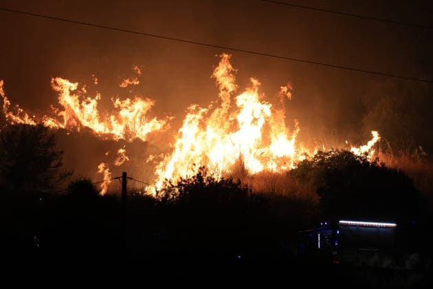 Wildfires continue in Italian island of Sicily PALERMO, ITALY - JULY 22: Wildfires that broke out in several parts of the Italian island of Sicily continue overnight, fueled by strong winds, as firefighters, civil protection teams and forestry crews press on with efforts to contain the blazes near Palermo, Sicily, Italy on July 22, 2026. The wildfires, which started yesterday on the slopes of Mount Longa near the city of Palermo, spread rapidly due to the wind and burned throughout the night. Alberto Lo Bianco Anadolu Palermo Italy. Editorial use only. Please get in touch for any other usage.  Copyright: x2026xAnadoluxAlbertoxLoxBiancox