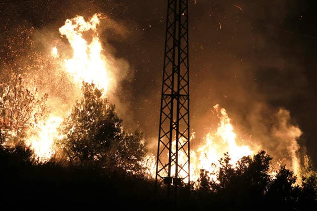 Wildfires continue in Italian island of Sicily PALERMO, ITALY - JULY 22: Wildfires that broke out in several parts of the Italian island of Sicily continue overnight, fueled by strong winds, as firefighters, civil protection teams and forestry crews press on with efforts to contain the blazes near Palermo, Sicily, Italy on July 22, 2026. The wildfires, which started yesterday on the slopes of Mount Longa near the city of Palermo, spread rapidly due to the wind and burned throughout the night. Alberto Lo Bianco Anadolu Palermo Italy. Editorial use only. Please get in touch for any other usage.  Copyright: x2026xAnadoluxAlbertoxLoxBiancox