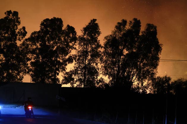 Wildfires continue in Italian island of Sicily PALERMO, ITALY - JULY 22: Wildfires that broke out in several parts of the Italian island of Sicily continue overnight, fueled by strong winds, as firefighters, civil protection teams and forestry crews press on with efforts to contain the blazes near Palermo, Sicily, Italy on July 22, 2026. The wildfires, which started yesterday on the slopes of Mount Longa near the city of Palermo, spread rapidly due to the wind and burned throughout the night. Alberto Lo Bianco Anadolu Palermo Italy. Editorial use only. Please get in touch for any other usage.  Copyright: x2026xAnadoluxAlbertoxLoxBiancox