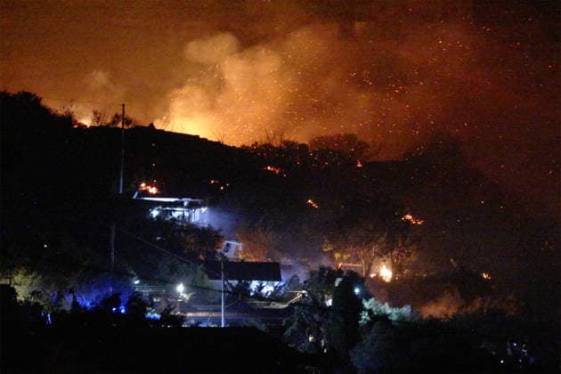 Wildfires continue in Italian island of Sicily PALERMO, ITALY - JULY 22: Wildfires that broke out in several parts of the Italian island of Sicily continue overnight, fueled by strong winds, as firefighters, civil protection teams and forestry crews press on with efforts to contain the blazes near Palermo, Sicily, Italy on July 22, 2026. The wildfires, which started yesterday on the slopes of Mount Longa near the city of Palermo, spread rapidly due to the wind and burned throughout the night. Alberto Lo Bianco Anadolu Palermo Italy. Editorial use only. Please get in touch for any other usage.  Copyright: x2026xAnadoluxAlbertoxLoxBiancox