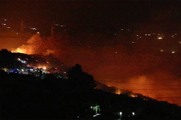 Wildfires continue in Italian island of Sicily PALERMO, ITALY - JULY 22: Wildfires that broke out in several parts of the Italian island of Sicily continue overnight, fueled by strong winds, as firefighters, civil protection teams and forestry crews press on with efforts to contain the blazes near Palermo, Sicily, Italy on July 22, 2026. The wildfires, which started yesterday on the slopes of Mount Longa near the city of Palermo, spread rapidly due to the wind and burned throughout the night. Alberto Lo Bianco Anadolu Palermo Italy. Editorial use only. Please get in touch for any other usage.  Copyright: x2026xAnadoluxAlbertoxLoxBiancox
