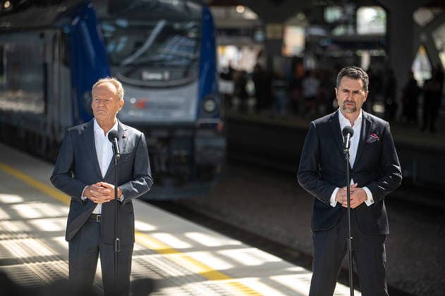 Warszawa 22.07.2026 Poland s Prime Minister Donald Tusk press conference on railway station Warsaw West. July 22, 2026 in Warsaw. --- Konferencja Prasowa Prezesa Rady Ministrow Donalda Tuska na dworcu kolejowym Warszawa Zachodnia w zwiazku z ogloszeniem programu NaszaKolej, 22 lipca 2026. Persons shown : Donald Tusk Piotr Malepszak Fot. Kai Taller Arena Akcji NEWSPIX.PL --- newspix.pl 
