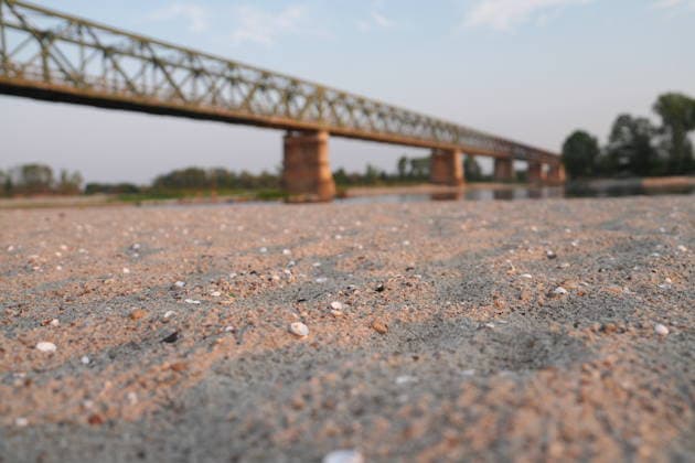 IPA86888844 - Mezzanino, Pavia, Ponte della Becca, July 22, 2026: The Po River has run dry; there is a water emergency and drought affecting Italy’s rivers. The Po River is 3 meters below its normal level, with vast stretches of sand; climate change and global warming.  Copyright: xDuilioxPiaggesix xDuilioxPiaggesix 86888844
