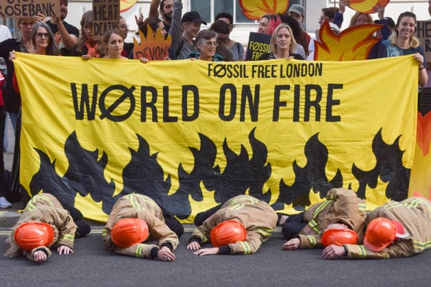 July 22, 2026, London, England, United Kingdom: Climate activists from Fossil Free London dressed as firefighters stage a protest outside the Department for Energy Security and Net Zero calling on the new Energy Secretary Miatta Fahnbulleh and the new UK Prime Minister Andy Burnham to stop the Rosebank oil and gas field in the North Sea. London United Kingdom - ZUMAv130 20260722_zip_v130_016 Copyright: xVukxValcicx
