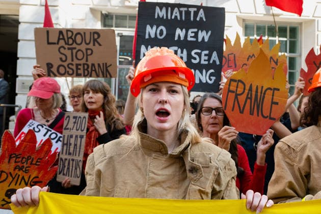 July 22, 2026, London, England, United Kingdom: Climate campaigners from Fossil Free London, Christian Climate Action and the Climate Choir stage a protest outside the Department for Energy Security and Net Zero (DESNZ) in Westminster, calling on the UK government to reject the proposed Rosebank oil field development in the North Sea. London United Kingdom - ZUMAk172 20260722_zip_k172_002 Copyright: xThomasxKrychx