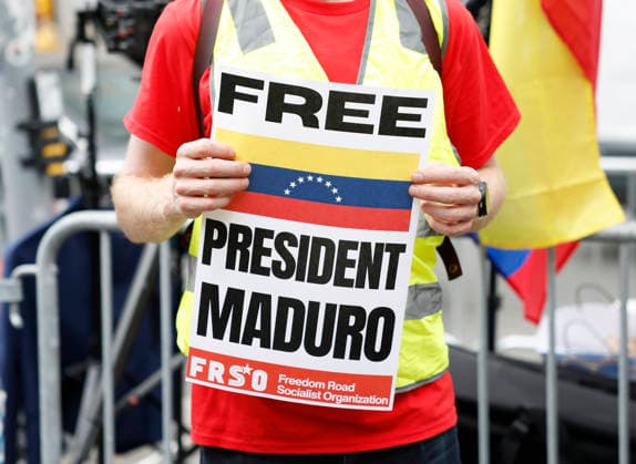 Protesters gather outside at Manhattan Court where ousted Venezuelan President Nicolas Maduro will appear for a hearing on Wednesday, July 22, 2026 in New York City. Venezuela s ousted President Nicolas Maduro and his ?wife ?Cilia Flores are back in a U.S. ?court on Wednesday for a hearing over the upcoming schedule in their drug trafficking case, including a possible ?June 2027 trial start date.  NYP20260722101 JOHNxANGELILLO