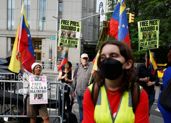 Protesters gather outside at Manhattan Court where ousted Venezuelan President Nicolas Maduro will appear for a hearing on Wednesday, July 22, 2026 in New York City. Venezuela s ousted President Nicolas Maduro and his ?wife ?Cilia Flores are back in a U.S. ?court on Wednesday for a hearing over the upcoming schedule in their drug trafficking case, including a possible ?June 2027 trial start date.  NYP20260722102 JOHNxANGELILLO