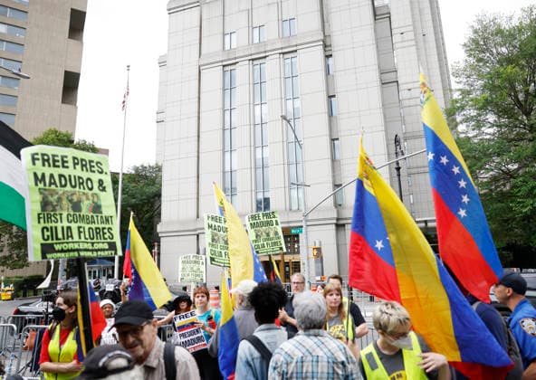 Protesters gather outside at Manhattan Court where ousted Venezuelan President Nicolas Maduro will appear for a hearing on Wednesday, July 22, 2026 in New York City. Venezuela s ousted President Nicolas Maduro and his ?wife ?Cilia Flores are back in a U.S. ?court on Wednesday for a hearing over the upcoming schedule in their drug trafficking case, including a possible ?June 2027 trial start date.  NYP20260722105 JOHNxANGELILLO