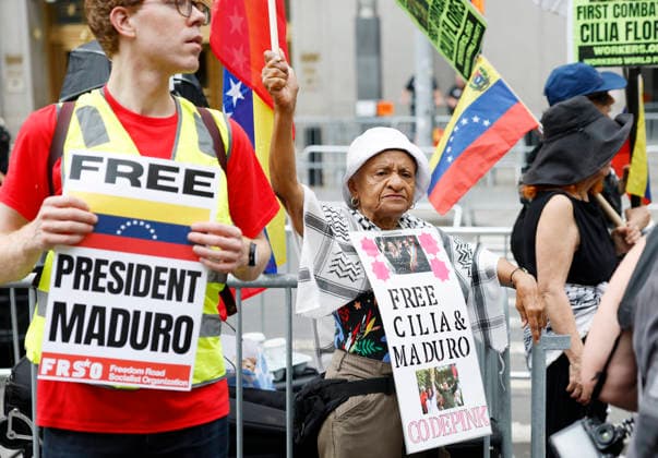 Protesters gather outside at Manhattan Court where ousted Venezuelan President Nicolas Maduro will appear for a hearing on Wednesday, July 22, 2026 in New York City. Venezuela s ousted President Nicolas Maduro and his ?wife ?Cilia Flores are back in a U.S. ?court on Wednesday for a hearing over the upcoming schedule in their drug trafficking case, including a possible ?June 2027 trial start date.  NYP20260722106 JOHNxANGELILLO