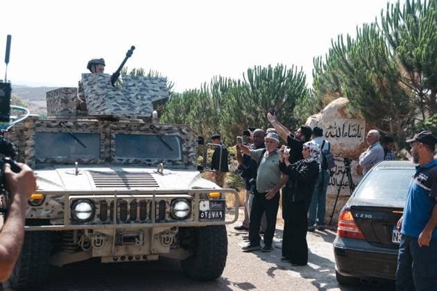 July 22, 2026, Zawtar Al-Gharbiya, Lebanon: ZAWTAR AL-GHARBIYA, LEBANON Ã¢â‚¬ JULY 22, 2026: The Lebanese army deploys in Zawtar Al-Gharbiya, southern Lebanon, one of three Ã¢â‚¬oepilot zonesÃ¢â‚¬Â placed under its control on Tuesday as part of a U.S.-brokered agreement with Israel. As soldiers clear unexploded ordnance, villagers wait behind a security cordon on the outskirts of the village for permission to return. Zawtar Al-Gharbiya Lebanon - ZUMAq101 20260722_zna_q101_050 Copyright: xKatrinexDigexHoumoÂ¸Llerx