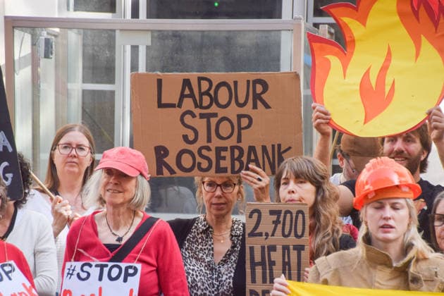 July 22, 2026, London, United Kingdom: A protester holds a Labour stop Rosebank placard during a protest outside the Department for Energy Security and Net Zero (DESNZ) organised by the group Fossil Free London, calling on the new Energy Secretary Miatta Fahnbulleh and the new UK Prime Minister Andy Burnham to stop the Rosebank oil and gas field in the North Sea. London United Kingdom - ZUMAs197 20260722_aaa_s197_033 Copyright: xVukxValcicx