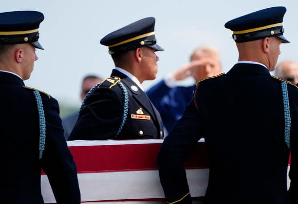 President Donald Trump watches as a U.S. Army carry team carries the transfer case containing the remains of Army Sgt. Angel Rampersad during a dignified transfer at Dover Air Force Base in Dover, Delaware on Wednesday, July 22, 2026. Rampersad was one of three soldiers killed as a result of Iranian strikes on Muwaffaq Salti Air Base in Jordan on July 17.  DEL202607222011 BONNIExCASH
