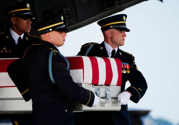 President Donald Trump watches as a U.S. Army carry team carries the transfer case containing the remains of Army Sgt. Angel Rampersad during a dignified transfer at Dover Air Force Base in Dover, Delaware on Wednesday, July 22, 2026. Rampersad was one of three soldiers killed as a result of Iranian strikes on Muwaffaq Salti Air Base in Jordan on July 17.  DEL202607222010 BONNIExCASH