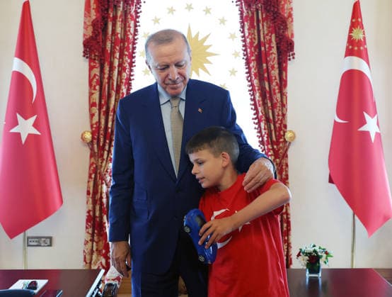 Turkish President Recep Tayyip Erdogan ISTANBUL, TURKIYE - JULY 22: (----EDITORIAL USE ONLY - MANDATORY CREDIT - TURKISH PRESIDENCY MUSTAFA KAMACI HANDOUT - NO MARKETING NO ADVERTISING CAMPAIGNS - DISTRIBUTED AS A SERVICE TO CLIENTS----) Turkish President Recep Tayyip Erdogan meets 12-year-old British activist Joshua Harris, who has autism and is known for his Cake Not Hate campaign against anti-Muslim hate acts, at the Dolmabahce Presidential Working Office in Istanbul, Turkiye on July 22, 2026. TUR Presidency Mustafa Kamaci Anadolu Istanbul Turkey. Editorial use only. Please get in touch for any other usage.  Copyright: x2026xAnadoluxTURxPresidency MustafaxKamacix