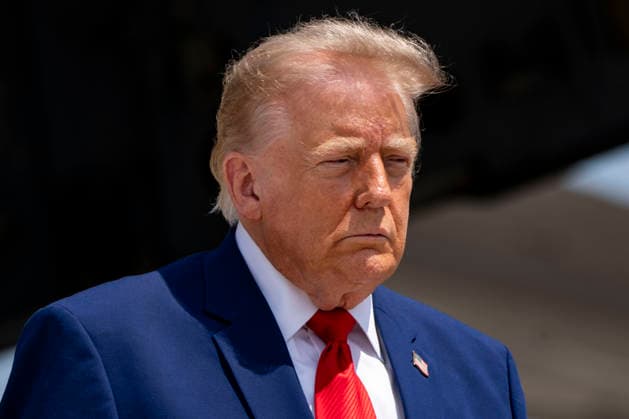 President Donald Trump attends the dignified transfer of Army 1st Lt. Tyler James Feehan, Army Staff Sgt. Emmanuel Swinton, Army Sgt. Angel Rampersad and Army Pvt. Isabella Gonzales at Dover Air Force Base in Dover, Delaware on Wednesday, July 22, 2026.  WAP20260722354 BONNIExCASH