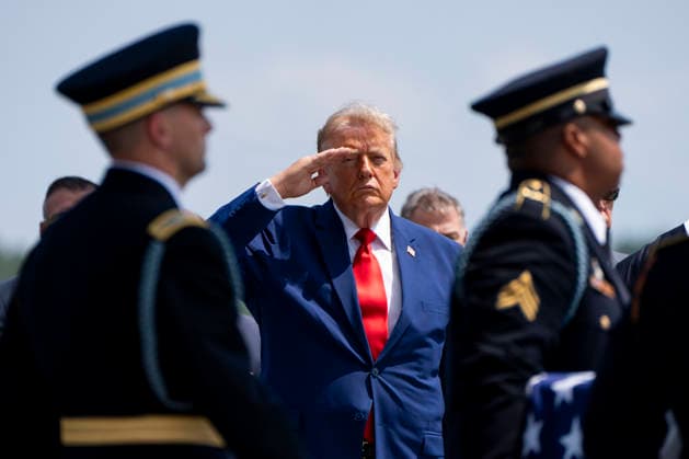 President Donald Trump watches as a U.S. Army carry team carries the transfer case containing the remains of Army Sgt. Angel Rampersad during a dignified transfer at Dover Air Force Base in Dover, Delaware on Wednesday, July 22, 2026. Rampersad was one of three soldiers killed as a result of Iranian strikes on Muwaffaq Salti Air Base in Jordan on July 17.  WAP20260722359 BONNIExCASH