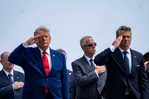 President Donald Trump and Secretary of Defense Pete Hegseth salute after the dignified transfer of Army 1st Lt. Tyler James Feehan, Army Staff Sgt. Emmanuel Swinton, Army Sgt. Angel Rampersad and Army Pvt. Isabella Gonzales at Dover Air Force Base in Dover, Delaware on Wednesday, July 22, 2026.  WAP20260722366 BONNIExCASH