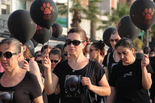 July 22, 2026, Â°Zmir, ToÂ¼rkiye: IZMIR, TURKEY Ã¢â‚¬ JULY 22, 2026: Participants dressed in black walk silently from Pasaport Ferry Terminal to Alsancak Ferry Terminal during an awareness march organized by volunteers to highlight the welfare and rights of stray animals. Carrying black balloons bearing the words One Life Lost, demonstrators complete the march without chanting slogans before delivering a brief press statement at the end of the route. Â°Zmir Türkiye  - ZUMAq101 20260722_zna_q101_210 Copyright: xNagihanxCakirx