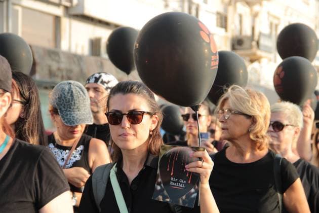 July 22, 2026, Â°Zmir, ToÂ¼rkiye: IZMIR, TURKEY Ã¢â‚¬ JULY 22, 2026: Participants dressed in black walk silently from Pasaport Ferry Terminal to Alsancak Ferry Terminal during an awareness march organized by volunteers to highlight the welfare and rights of stray animals. Carrying black balloons bearing the words One Life Lost, demonstrators complete the march without chanting slogans before delivering a brief press statement at the end of the route. Â°Zmir Türkiye  - ZUMAq101 20260722_zna_q101_213 Copyright: xNagihanxCakirx