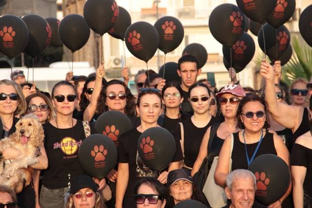 July 22, 2026, Â°Zmir, ToÂ¼rkiye: IZMIR, TURKEY Ã¢â‚¬ JULY 22, 2026: Participants dressed in black walk silently from Pasaport Ferry Terminal to Alsancak Ferry Terminal during an awareness march organized by volunteers to highlight the welfare and rights of stray animals. Carrying black balloons bearing the words One Life Lost, demonstrators complete the march without chanting slogans before delivering a brief press statement at the end of the route. Â°Zmir Türkiye  - ZUMAq101 20260722_zna_q101_215 Copyright: xNagihanxCakirx