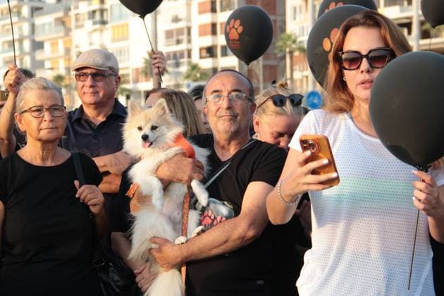 July 22, 2026, Â°Zmir, ToÂ¼rkiye: IZMIR, TURKEY Ã¢â‚¬ JULY 22, 2026: Participants dressed in black walk silently from Pasaport Ferry Terminal to Alsancak Ferry Terminal during an awareness march organized by volunteers to highlight the welfare and rights of stray animals. Carrying black balloons bearing the words One Life Lost, demonstrators complete the march without chanting slogans before delivering a brief press statement at the end of the route. Â°Zmir Türkiye  - ZUMAq101 20260722_zna_q101_216 Copyright: xNagihanxCakirx