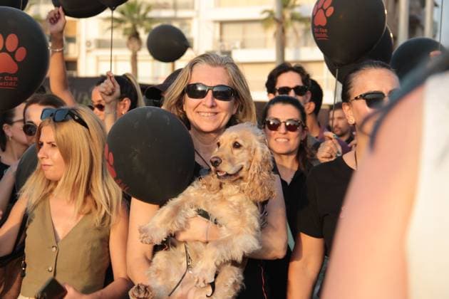 July 22, 2026, Â°Zmir, ToÂ¼rkiye: IZMIR, TURKEY Ã¢â‚¬ JULY 22, 2026: Participants dressed in black walk silently from Pasaport Ferry Terminal to Alsancak Ferry Terminal during an awareness march organized by volunteers to highlight the welfare and rights of stray animals. Carrying black balloons bearing the words One Life Lost, demonstrators complete the march without chanting slogans before delivering a brief press statement at the end of the route. Â°Zmir Türkiye - ZUMAq101 20260722_zna_q101_208 Copyright: xNagihanxCakirx