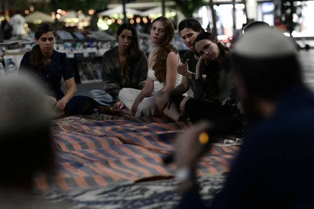 July 22, 2026, Tel-Aviv, Israel: TEL AVIV, ISRAEL Ã¢â‚¬ JULY 22, 2026: Dozens of Jewish worshippers gather at Dizengoff Square in central Tel Aviv for a public reading of the Book of Lamentations on the eve of Tisha B Av, the annual Jewish day of mourning commemorating the destruction of the First and Second Temples in Jerusalem. The observance is marked by prayers, fasting and the reading of biblical texts recalling the tragedies in Jewish history. Tel-Aviv Israel  - ZUMAq101 20260722_zna_q101_235 Copyright: xTomerxNeubergx