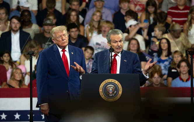 July 22, 2026, Marietta, Georgia, USA: President DONALD TRUMP listens as GeorgiaÃ¢â‚¬â ¢s Republican candidate for Governor RICK JACKSON shares his plans to crowd at a rally at Wheeler High School. Marietta USA - ZUMAn03_ 20260722_zaf_n03_022 Copyright: xRobinxRaynex