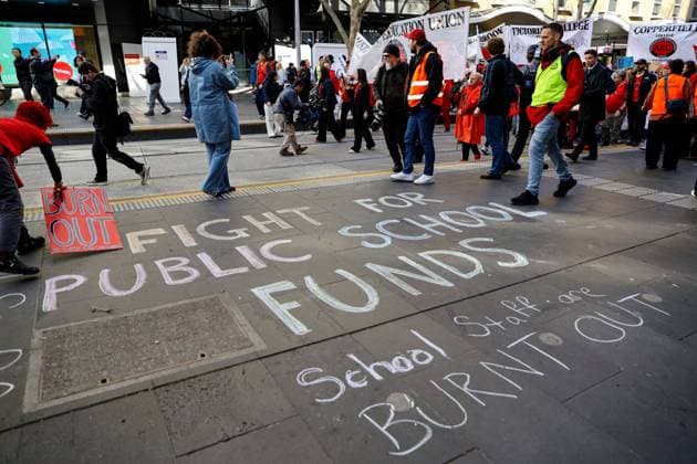 July 23, 2026, Melbourne, Australia: MELBOURNE, AUSTRALIA Ã¢â‚¬ JULY 23, 2026: Members of the Australian Education Union (AEU) march from Bourke Street Mall to the Victorian Parliament during a rally calling on the Victorian Government to fully fund public schools and present a revised Victorian Government Schools Agreement (VGSA). The demonstration forms part of statewide industrial action, with teachers and education support staff seeking improved pay, better working conditions and increased investment in public education. Melbourne Australia - ZUMAq101 20260723_zna_q101_019 Copyright: xYexMyoxKhantx
