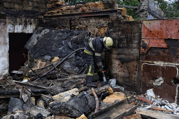 A rescuer extinguishes a fire at a two-storey residential building partially destroyed by a Russian drone attack, Odesa, Ukraine, July 22, 2026. In the morning, the Russian army struck the southern port city with attack drones, killing a man and injuring two people - an 82-year-old woman and a 54-year-old man. (Photo by Nina Liashonok Ukrinform) Russian army attacks Odesa with drones, killing 1 man  Copyright: xNinaxLiashonokx