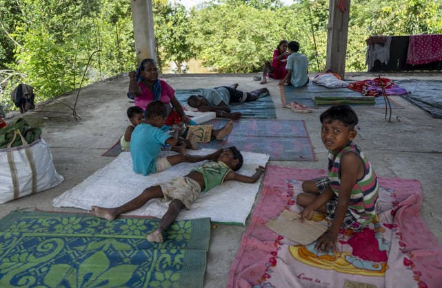 Flood in Indian Northeastern State Assam JORHAT, INDIA - JULY 22: Flood-affected residents take shelter in a building after being displaced by rising floodwaters, on July 22, 2026 in Jorhat, India. The flood situation in Assam remained critical, with more than 630,000 people affected across 21 districts. The state’s death toll has risen to 12. David Talukdar Anadolu Jorhat India. Editorial use only. Please get in touch for any other usage.  Copyright: x2026xAnadoluxDavidxTalukdarx