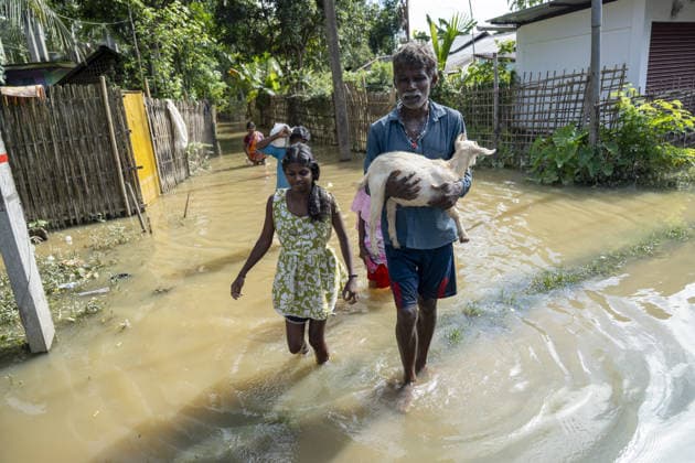 Flood in Indian Northeastern State Assam JORHAT, INDIA - JULY 22: Residents wade through floodwaters while carrying a goat and salvaged belongings from their inundated homes in a flood-affected neighborhood, on July 22, 2026 in Jorhat, India. The flood situation in Assam remained critical, with more than 630,000 people affected across 21 districts. The state’s death toll has risen to 12. David Talukdar Anadolu Jorhat India. Editorial use only. Please get in touch for any other usage.  Copyright: x2026xAnadoluxDavidxTalukdarx