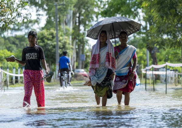 Flood in Indian Northeastern State Assam JORHAT, INDIA - JULY 22: Residents wade through a flooded road as rising floodwaters inundate a residential area following heavy rainfall, on July 22, 2026 in Jorhat, India. The flood situation in Assam remained critical, with more than 630,000 people affected across 21 districts. The state’s death toll has risen to 12. David Talukdar Anadolu Jorhat India. Editorial use only. Please get in touch for any other usage.  Copyright: x2026xAnadoluxDavidxTalukdarx