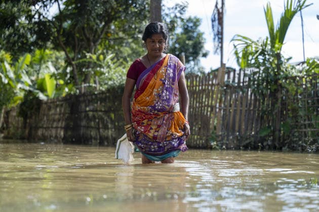 Flood in Indian Northeastern State Assam JORHAT, INDIA - JULY 22: Resident wade through a flooded road as rising floodwaters inundate a residential area following heavy rainfall, on July 22, 2026 in Jorhat, India. The flood situation in Assam remained critical, with more than 630,000 people affected across 21 districts. The state’s death toll has risen to 12. David Talukdar Anadolu Jorhat India. Editorial use only. Please get in touch for any other usage.  Copyright: x2026xAnadoluxDavidxTalukdarx
