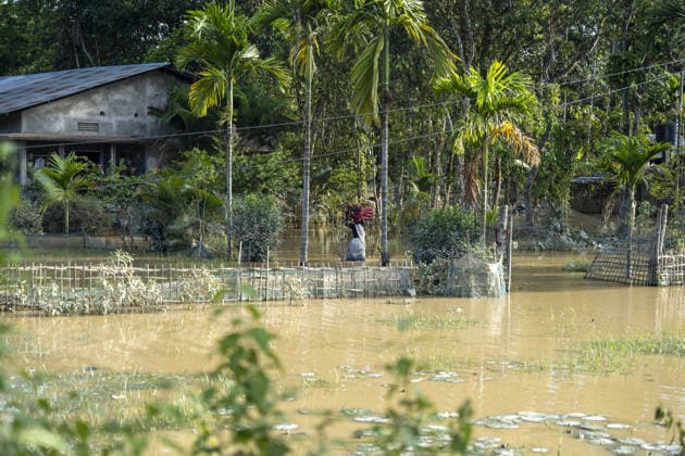 Flood in Indian Northeastern State Assam JORHAT, INDIA - JULY 22: A resident carries dried cushions on her head while wading through floodwaters in a flood-affected neighborhood, on July 22, 2026 in Jorhat, India. The flood situation in Assam remained critical, with more than 630,000 people affected across 21 districts. The state’s death toll has risen to 12. David Talukdar Anadolu Jorhat India. Editorial use only. Please get in touch for any other usage.  Copyright: x2026xAnadoluxDavidxTalukdarx