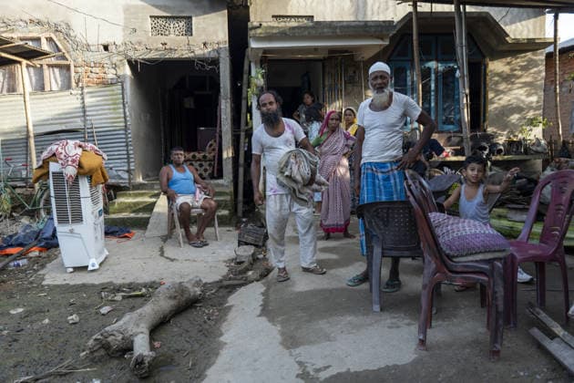 Flood in Indian Northeastern State Assam JORHAT, INDIA - JULY 22: Flood-affected residents stand outside their mud-covered homes after floodwaters receded in a residential neighborhood, on July 22, 2026 in Jorhat, India. The flood situation in Assam remained critical, with more than 630,000 people affected across 21 districts. The state’s death toll has risen to 12. David Talukdar Anadolu Jorhat India. Editorial use only. Please get in touch for any other usage.  Copyright: x2026xAnadoluxDavidxTalukdarx