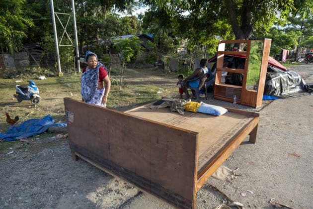 Flood in Indian Northeastern State Assam JORHAT, INDIA - JULY 22: A flood-affected resident stands beside household furniture and belongings placed along a roadside after being moved from an inundated home, on July 22, 2026 in Jorhat, India. The flood situation in Assam remained critical, with more than 630,000 people affected across 21 districts. The state’s death toll has risen to 12. David Talukdar Anadolu Jorhat India. Editorial use only. Please get in touch for any other usage.  Copyright: x2026xAnadoluxDavidxTalukdarx
