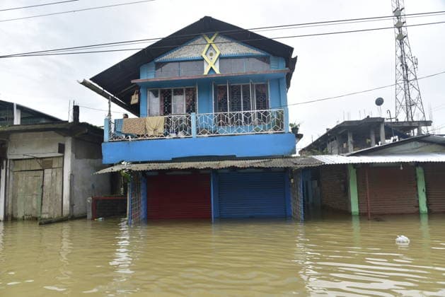 Heavy rainfall triggers severe flooding in Assam, India SIVSAGAR, INDIA - JULY 23: Houses are partially submerged in floodwater after heavy rainfall affects areas in Sivsagar district, Assam, India on July 23, 2026. Continuous heavy rainfall over the past few days has triggered severe flooding across several parts of Sivsagar district in Assam, leaving thousands of residents affected and disrupting normal life. Hafiz Ahmed Anadolu Sivsagar India. Editorial use only. Please get in touch for any other usage.  Copyright: x2026xAnadoluxHafizxAhmedx