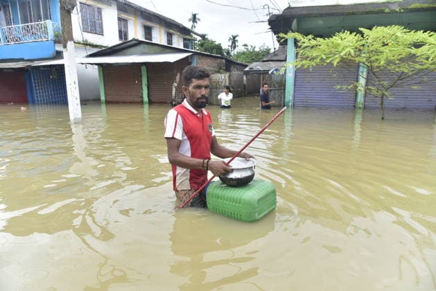 Heavy rainfall triggers severe flooding in Assam, India SIVSAGAR, INDIA - JULY 23: People walk through flooded streets after heavy rainfall affects areas in Sivsagar district, Assam, India on July 23, 2026. Continuous heavy rainfall over the past few days has triggered severe flooding across several parts of Sivsagar district in Assam, leaving thousands of residents affected and disrupting normal life. Hafiz Ahmed Anadolu Sivsagar India. Editorial use only. Please get in touch for any other usage.  Copyright: x2026xAnadoluxHafizxAhmedx