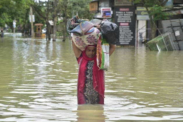 Heavy rainfall triggers severe flooding in Assam, India SIVSAGAR, INDIA - JULY 23: People walk through flooded streets after heavy rainfall affects areas in Sivsagar district, Assam, India on July 23, 2026. Continuous heavy rainfall over the past few days has triggered severe flooding across several parts of Sivsagar district in Assam, leaving thousands of residents affected and disrupting normal life. Hafiz Ahmed Anadolu Sivsagar India. Editorial use only. Please get in touch for any other usage.  Copyright: x2026xAnadoluxHafizxAhmedx
