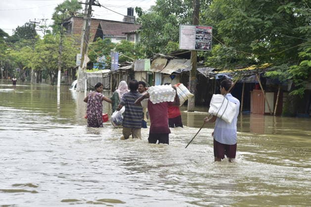 Heavy rainfall triggers severe flooding in Assam, India SIVSAGAR, INDIA - JULY 23: People walk through flooded streets after heavy rainfall affects areas in Sivsagar district, Assam, India on July 23, 2026. Continuous heavy rainfall over the past few days has triggered severe flooding across several parts of Sivsagar district in Assam, leaving thousands of residents affected and disrupting normal life. Hafiz Ahmed Anadolu Sivsagar India. Editorial use only. Please get in touch for any other usage.  Copyright: x2026xAnadoluxHafizxAhmedx