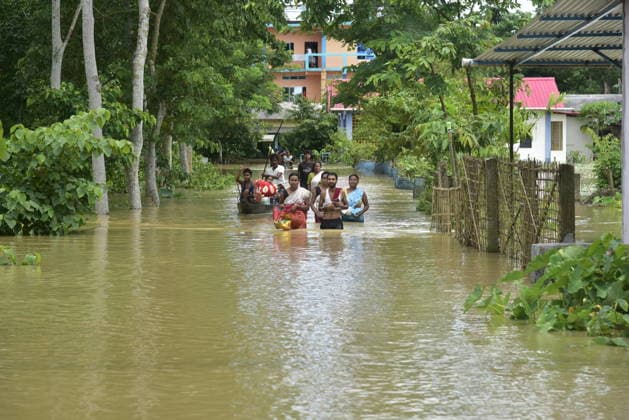 Heavy rainfall triggers severe flooding in Assam, India SIVSAGAR, INDIA - JULY 23: People walk through flooded streets after heavy rainfall affects areas in Sivsagar district, Assam, India on July 23, 2026. Continuous heavy rainfall over the past few days has triggered severe flooding across several parts of Sivsagar district in Assam, leaving thousands of residents affected and disrupting normal life. Hafiz Ahmed Anadolu Sivsagar India. Editorial use only. Please get in touch for any other usage.  Copyright: x2026xAnadoluxHafizxAhmedx