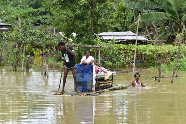 Heavy rainfall triggers severe flooding in Assam, India SIVSAGAR, INDIA - JULY 23: People walk through flooded streets after heavy rainfall affects areas in Sivsagar district, Assam, India on July 23, 2026. Continuous heavy rainfall over the past few days has triggered severe flooding across several parts of Sivsagar district in Assam, leaving thousands of residents affected and disrupting normal life. Hafiz Ahmed Anadolu Sivsagar India. Editorial use only. Please get in touch for any other usage.  Copyright: x2026xAnadoluxHafizxAhmedx