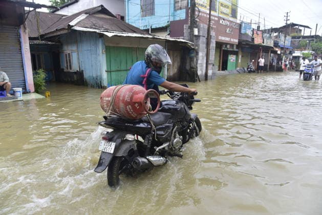 Heavy rainfall triggers severe flooding in Assam, India SIVSAGAR, INDIA - JULY 23: People walk through flooded streets after heavy rainfall affects areas in Sivsagar district, Assam, India on July 23, 2026. Continuous heavy rainfall over the past few days has triggered severe flooding across several parts of Sivsagar district in Assam, leaving thousands of residents affected and disrupting normal life. Hafiz Ahmed Anadolu Sivsagar India. Editorial use only. Please get in touch for any other usage.  Copyright: x2026xAnadoluxHafizxAhmedx