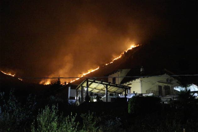 Wildfire threatens communities near Palermo in Sicily as firefighting efforts continue PALERMO, ITALY - JULY 23: Firefighters and civil protection teams battle a wildfire in the Casaboli Forest near Palermo as strong winds push the blaze toward the towns of Monreale, Pioppo and Sagana, while residents are evacuated from threatened homes, in Palermo, Sicily, Italy on July 23, 2026. The wildfire, which started the previous day, spread overnight, prompting emergency crews to work continuously to contain the flames and protect nearby communities. Alberto Lo Bianco Anadolu Palermo Italy. Editorial use only. Please get in touch for any other usage.  Copyright: x2026xAnadoluxAlbertoxLoxBiancox